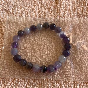 Lovely bracelet, with purple and lavender colors.